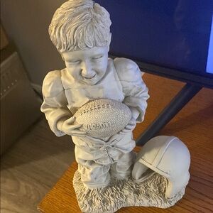Charming Gray Football Player Sculpture